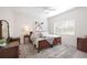Cozy bedroom with elegant furnishings and decor at 6702 Pinehurst Pl, Bradenton, FL 34202