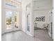 Open and airy entryway with a view into an adjacent home office at 6702 Pinehurst Pl, Bradenton, FL 34202