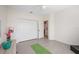 Bright home gym with whole body vibration machine and yoga mat at 6702 Pinehurst Pl, Bradenton, FL 34202