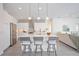 Modern kitchen with white island and stainless steel appliances at 6702 Pinehurst Pl, Bradenton, FL 34202