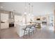 Modern kitchen with white cabinets, quartz countertops, and island at 6702 Pinehurst Pl, Bradenton, FL 34202