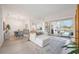 Spacious living area with access to the pool and dining area at 6702 Pinehurst Pl, Bradenton, FL 34202