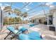 Spacious pool area with lounge chairs at 6702 Pinehurst Pl, Bradenton, FL 34202
