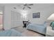 Cozy bedroom with twin beds, desk, and ceiling fan at 6807 Stone River Rd # 204, Bradenton, FL 34203