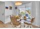 Small dining area with table and chairs, access to balcony at 6807 Stone River Rd # 204, Bradenton, FL 34203