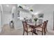 Dining room with wood table, six chairs, and kitchen view at 6807 Stone River Rd # 204, Bradenton, FL 34203