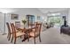 Bright dining area with wood table and chairs, near living room at 6807 Stone River Rd # 204, Bradenton, FL 34203