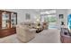 Spacious living room with comfortable seating and access to balcony at 6807 Stone River Rd # 204, Bradenton, FL 34203