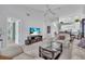 Open living room with high ceilings, and view to kitchen at 6807 Stone River Rd # 204, Bradenton, FL 34203
