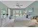 Spacious main bedroom with a king-size bed and large windows at 6807 Stone River Rd # 204, Bradenton, FL 34203