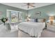 Main bedroom with king bed, light walls, and plenty of natural light at 6807 Stone River Rd # 204, Bradenton, FL 34203