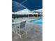 Resort-style pool with ample lounge chairs and shaded seating at 6807 Stone River Rd # 204, Bradenton, FL 34203