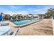 Community pool with lounge chairs and tables at 6807 Stone River Rd # 204, Bradenton, FL 34203