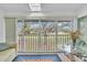 Sunroom with glass doors offering scenic views and a relaxing atmosphere at 6807 Stone River Rd # 204, Bradenton, FL 34203
