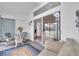 Sunroom with seating area and sliding doors leading to a balcony at 6807 Stone River Rd # 204, Bradenton, FL 34203