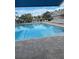 Relaxing community pool with spacious deck at 6807 Stone River Rd # 204, Bradenton, FL 34203