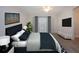 Main bedroom with a king-size bed and TV at 7213 Las Casas Dr, Sarasota, FL 34243