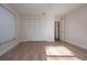 Bright bedroom with vinyl plank flooring and large closets at 7213 Las Casas Dr, Sarasota, FL 34243