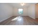 Bright bedroom with hardwood floors and a window at 7213 Las Casas Dr, Sarasota, FL 34243