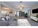 Living room with gray couch and a large TV at 7213 Las Casas Dr, Sarasota, FL 34243