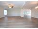 Spacious living room with light walls and wood-look floors at 7213 Las Casas Dr, Sarasota, FL 34243
