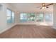 Sunroom with large windows and wood-look floors at 7213 Las Casas Dr, Sarasota, FL 34243
