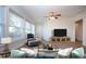 Sunroom with large windows and wood-look floors at 7213 Las Casas Dr, Sarasota, FL 34243