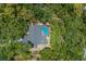 Bird's-eye view of a house with a private pool and lush surroundings at 7408 Oak Run Ln, Sarasota, FL 34243