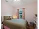 Bedroom with a view and pink walls at 7408 Oak Run Ln, Sarasota, FL 34243
