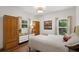 Cozy bedroom with wood flooring and ample closet space at 7408 Oak Run Ln, Sarasota, FL 34243