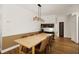 Light and airy dining room with a wooden table and six chairs at 7408 Oak Run Ln, Sarasota, FL 34243
