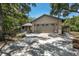 Two-car garage with gray doors and brick facade at 7408 Oak Run Ln, Sarasota, FL 34243