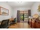 Bright home office with wood floors, window seat, and built-in cabinetry at 7408 Oak Run Ln, Sarasota, FL 34243