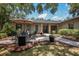 Relaxing patio with fire pit and seating area at 7408 Oak Run Ln, Sarasota, FL 34243