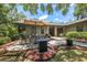 Relaxing patio with fire pit and seating area at 7408 Oak Run Ln, Sarasota, FL 34243