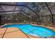 Inviting kidney-shaped pool with screened enclosure at 7408 Oak Run Ln, Sarasota, FL 34243