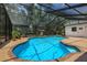 Inviting kidney-shaped pool with screened enclosure at 7408 Oak Run Ln, Sarasota, FL 34243
