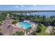Resort-style pool and clubhouse with lake view at 7504 Windy Hill Cv, Lakewood Ranch, FL 34202