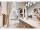 Elegant bathroom with a vanity, bathtub and modern fixtures at 7504 Windy Hill Cv, Lakewood Ranch, FL 34202