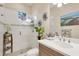 Clean bathroom with a walk-in shower, tiled walls and modern vanity at 7504 Windy Hill Cv, Lakewood Ranch, FL 34202