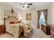 Spacious bedroom with a comfortable bed and decorative artwork at 7504 Windy Hill Cv, Lakewood Ranch, FL 34202