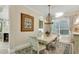 Bright dining room features a charming table and chairs, perfect for Gathering meals at 7504 Windy Hill Cv, Lakewood Ranch, FL 34202
