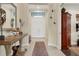 Bright entryway with hardwood floors and double doors at 7504 Windy Hill Cv, Lakewood Ranch, FL 34202