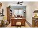 Elegant home office with built-in bookcases and a large desk at 7504 Windy Hill Cv, Lakewood Ranch, FL 34202