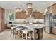 Gourmet kitchen with granite island and stainless steel appliances at 7504 Windy Hill Cv, Lakewood Ranch, FL 34202