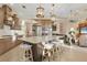 Gourmet kitchen boasts a large island, stainless steel appliances, and granite countertops at 7504 Windy Hill Cv, Lakewood Ranch, FL 34202