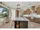 Modern kitchen with large island and breakfast nook at 7504 Windy Hill Cv, Lakewood Ranch, FL 34202