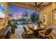 Relaxing lanai with fireplace and pool view at 7504 Windy Hill Cv, Lakewood Ranch, FL 34202