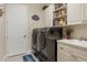 Bright laundry room with washer, dryer, and ample storage at 7504 Windy Hill Cv, Lakewood Ranch, FL 34202