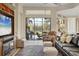 Comfortable living room with leather sofa and view of the pool at 7504 Windy Hill Cv, Lakewood Ranch, FL 34202